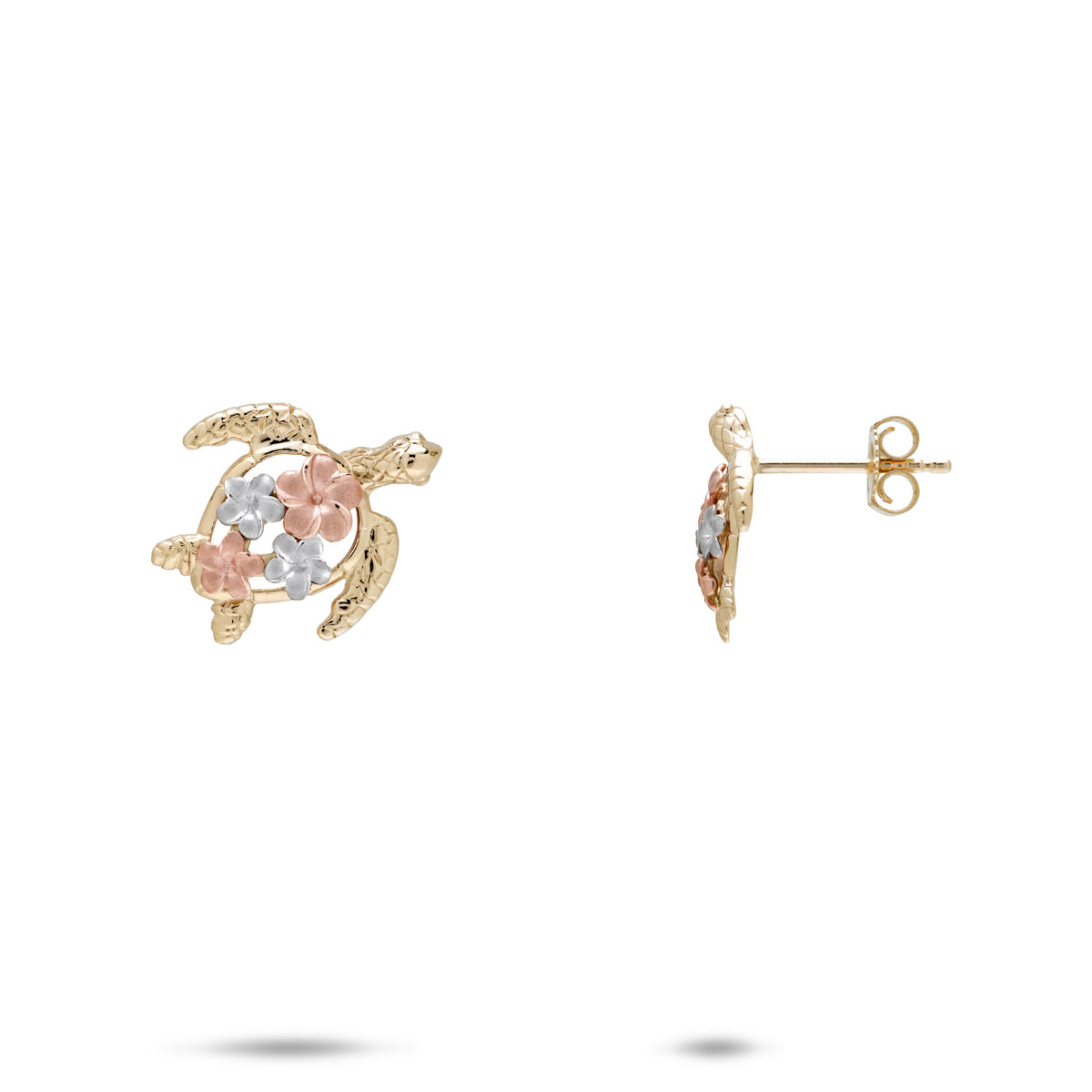 A pair of 14k yellow gold sea turtle stud earrings with rose and white gold plumerias as the shell, shown on a white background with one earring facing forward and the other in side profile.