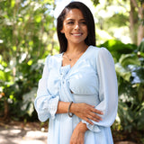 Woman wearing Tahitian Black Pearl Earrings in White Gold - 8-9mm in the forest in Hawaii