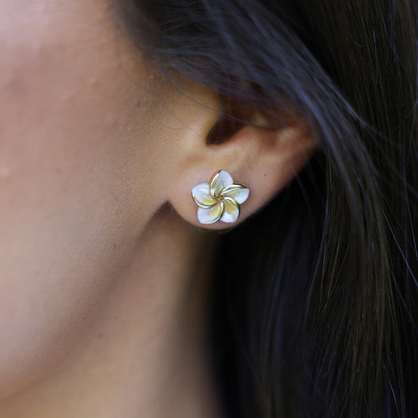 close up of woman wearing Plumeria Mother of Pearl Earrings in Gold - 13mm