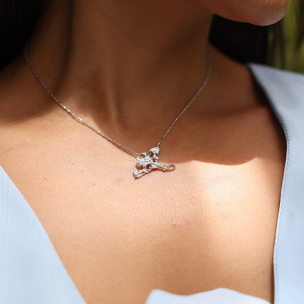 Close up of Manta Ray Pendant in White Gold with Diamonds on neckline