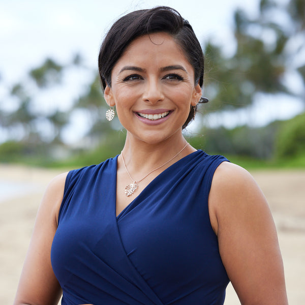 A woman wearing Monstera Pendant in Rose Gold with Diamonds - Maui Divers Jewelry