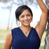 A woman wearing Reefs Starfish Tahitian Black Pearl Earrings in Gold with Diamonds - 10-11mm - Maui Divers Jewelry