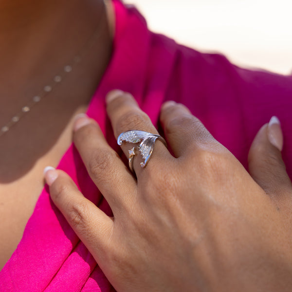 A woman's hand with a Moon Mermaid Ring in Two Tone Gold with Diamonds - Maui Divers Jewelry