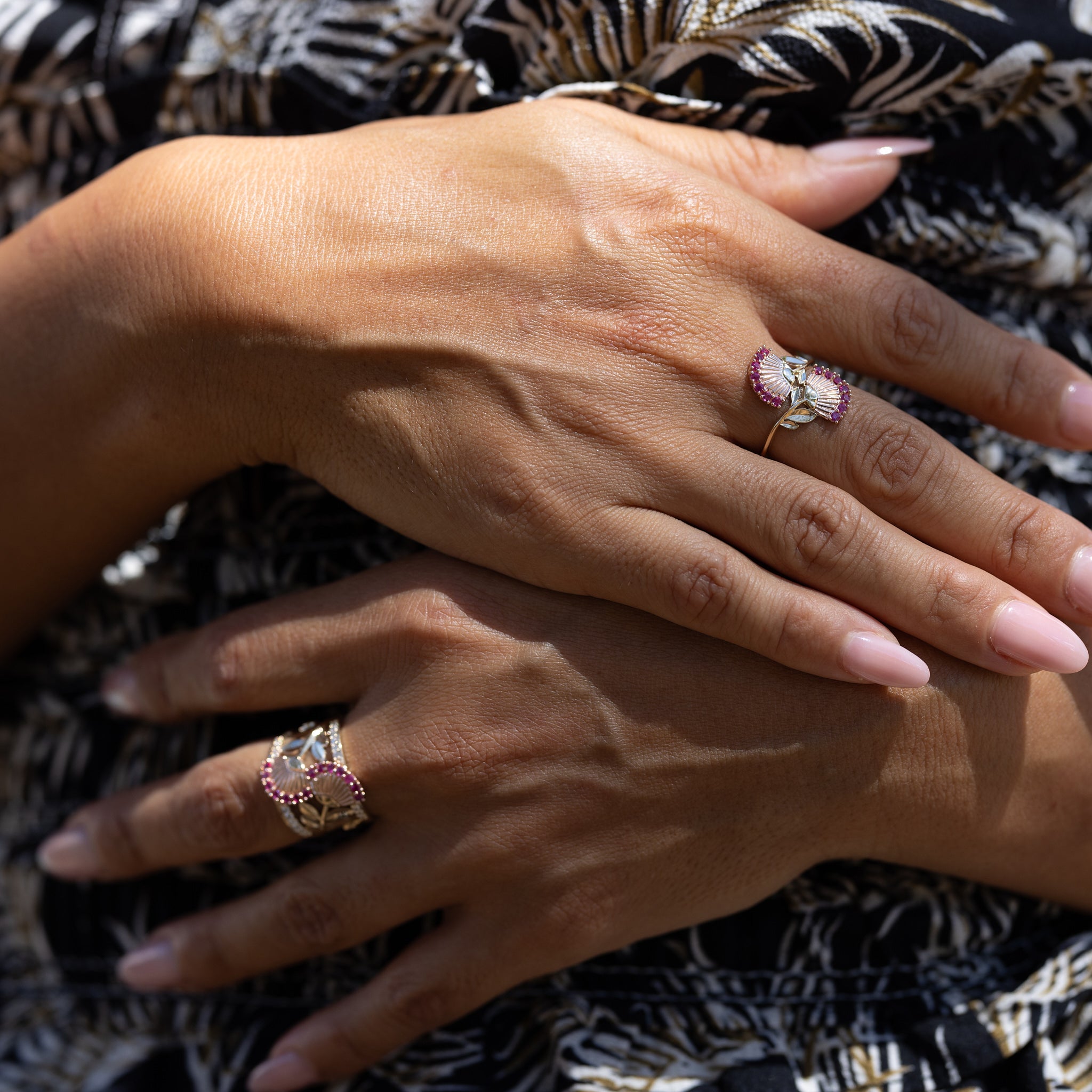 A woman's hand wearing a Ohia Lehua Ruby Ring in Two Tone Gold - 18mm - Maui Divers Jewelry