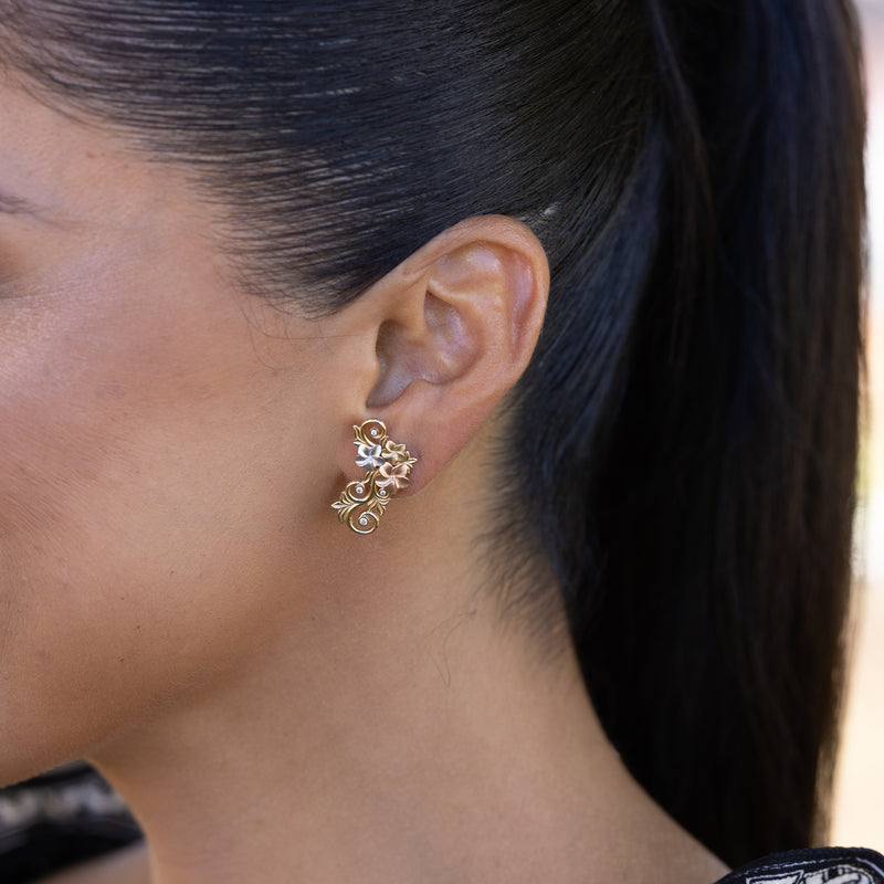 A woman's ear with Living Heirloom Plumeria Earrings in Tri Color Gold with diamonds - 25mm - Maui Divers Jewelry