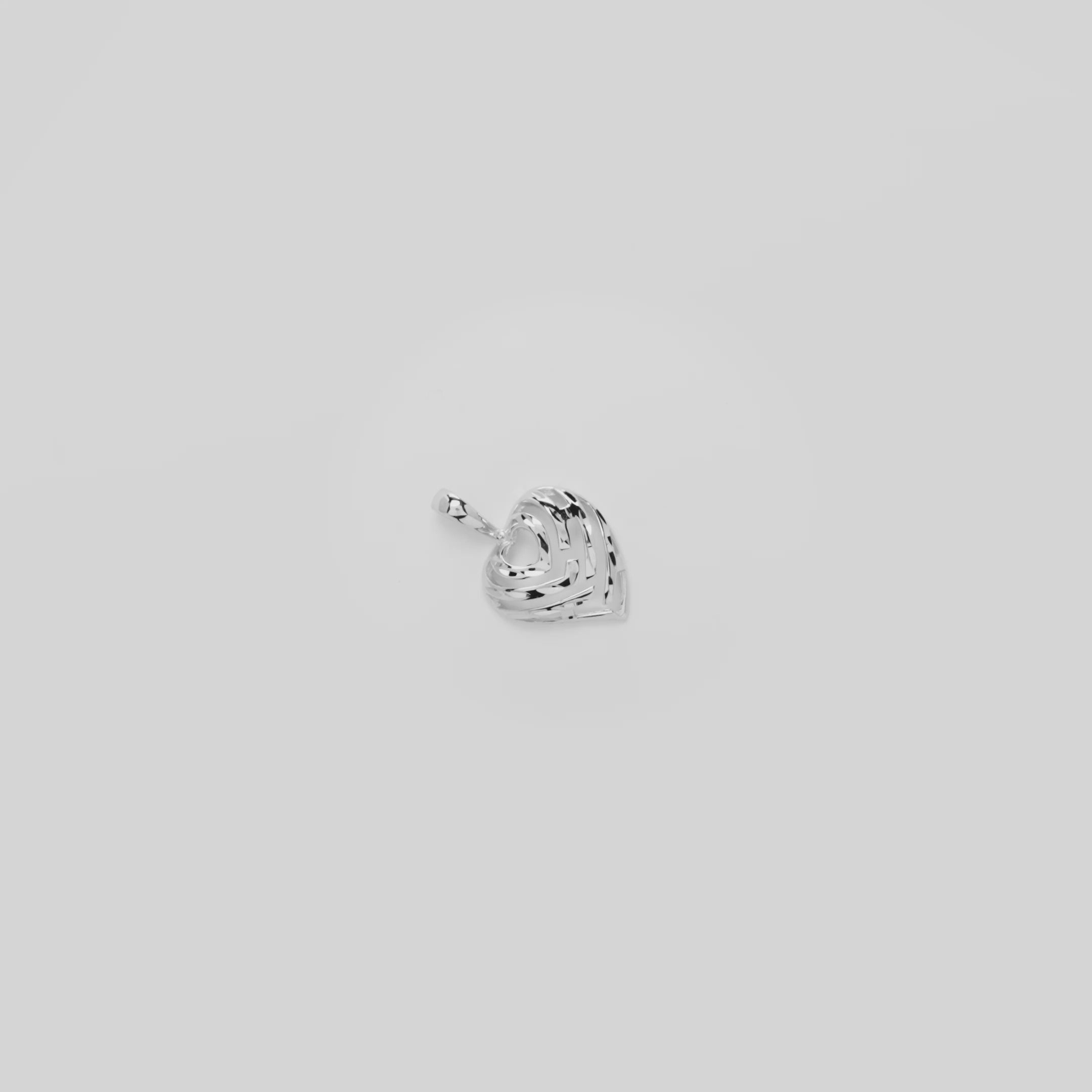 Video showcasing the 12mm Aloha Heart Pendant in White Gold on a turn table