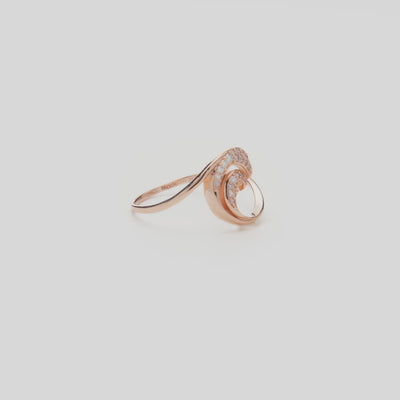 12mm Nalu Ring in Rose Gold with Diamonds on a white turntable