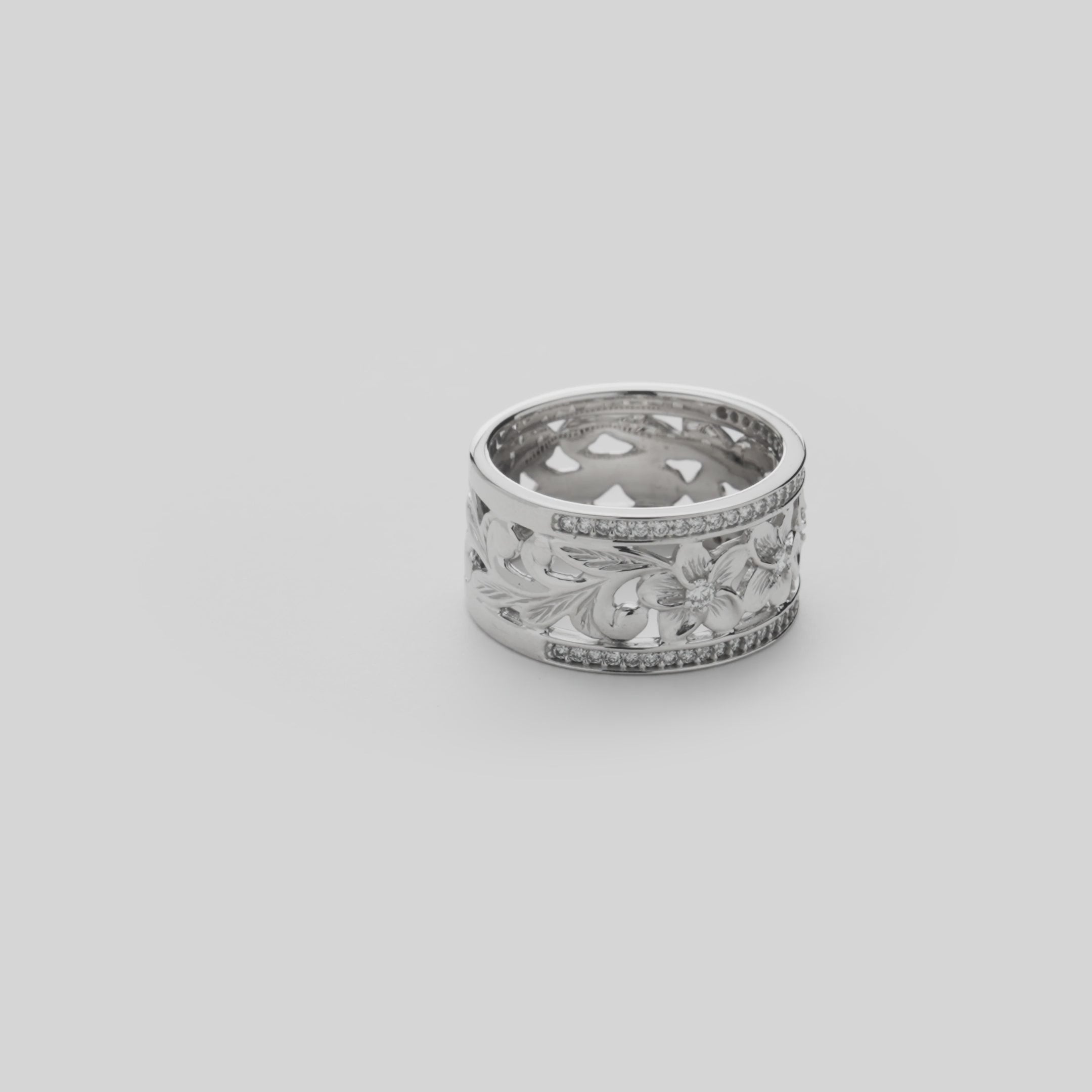 Video showcasing the Hawaiian Heirloom Plumeria Ring in White Gold with Diamonds - 10mm