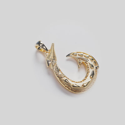 Close up video of Fish Hook Pendant in Gold on white turn table