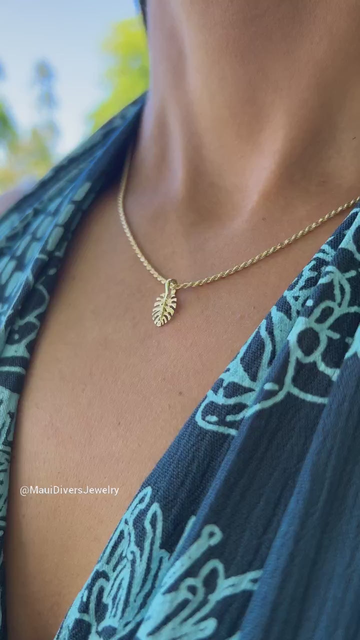 Video of a woman wearing a Monstera Pendant in Gold - 13.5mm - Maui Divers Jewelry