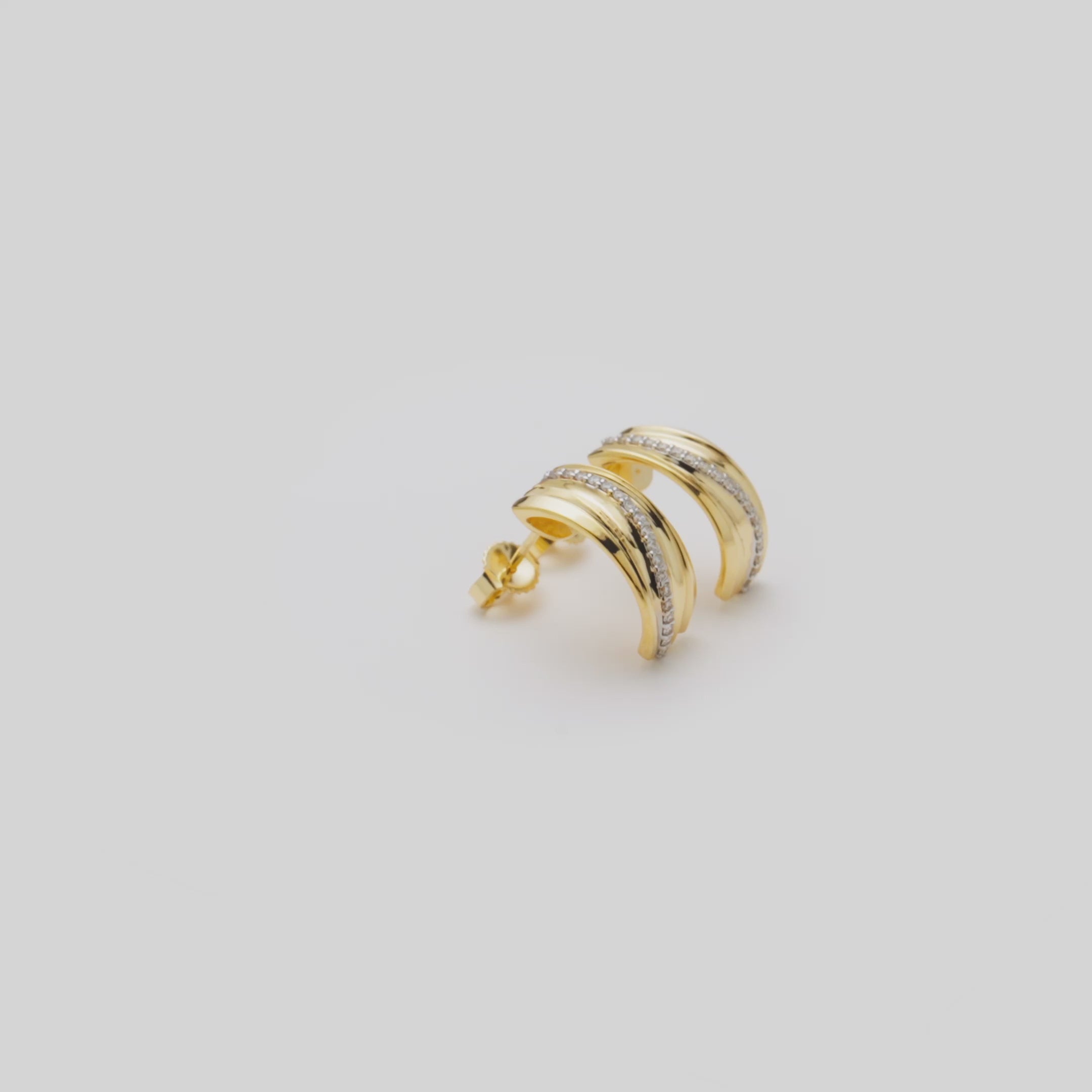 Video showcasing the 16mm Ocean Sand Half-Hoop Earrings in 14k Yellow Gold with Diamonds on a turn table