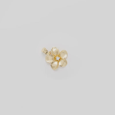 Video showcasing the 18mm Plumeria Pendant in 14k Yellow Gold with Diamond on a white background
