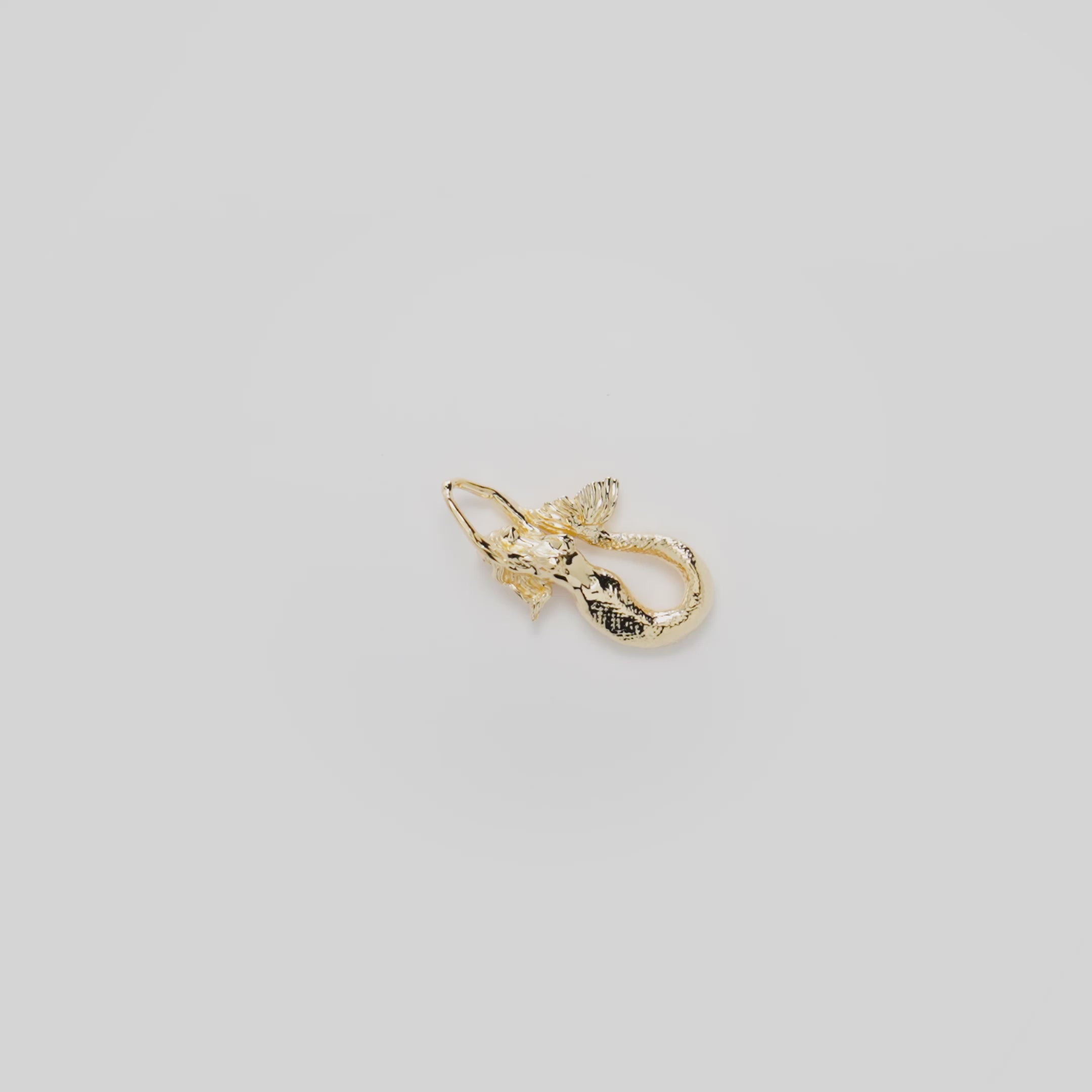 Video showcasing the 25mm Mermaid Pendant in 14k Yellow Gold on a turn table