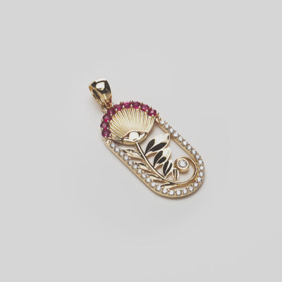 ʻŌhiʻa Lehua Ruby Pendant in Gold with Diamonds on a white turntable