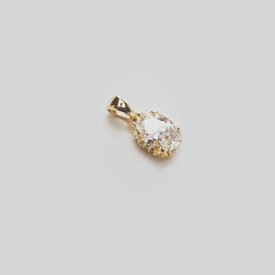 Close up video of the Hidden Hawaiʻi Maile Lab Grown Diamond Pendant in Gold on white turntable