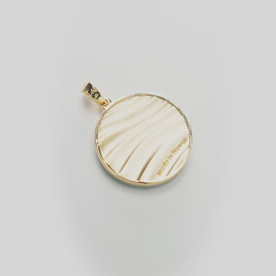Backside of Ocean Sand Turquoise Pendant in Gold on white turntable
