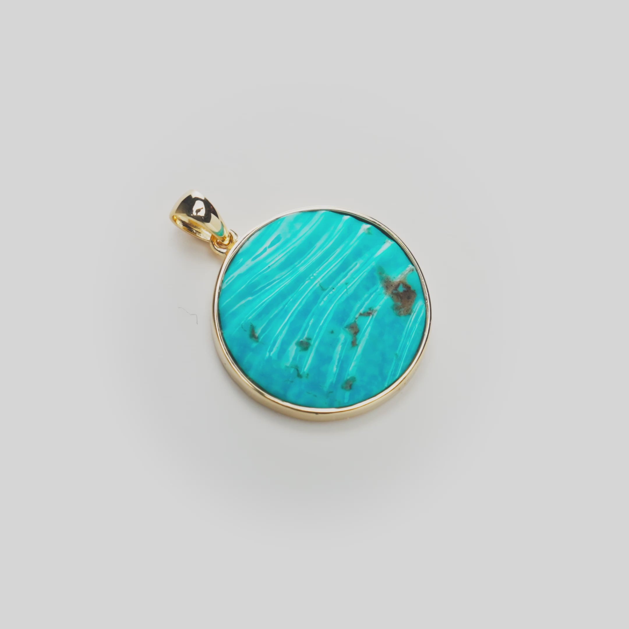 Ocean Sand Turquoise Pendant in Gold on white turntable