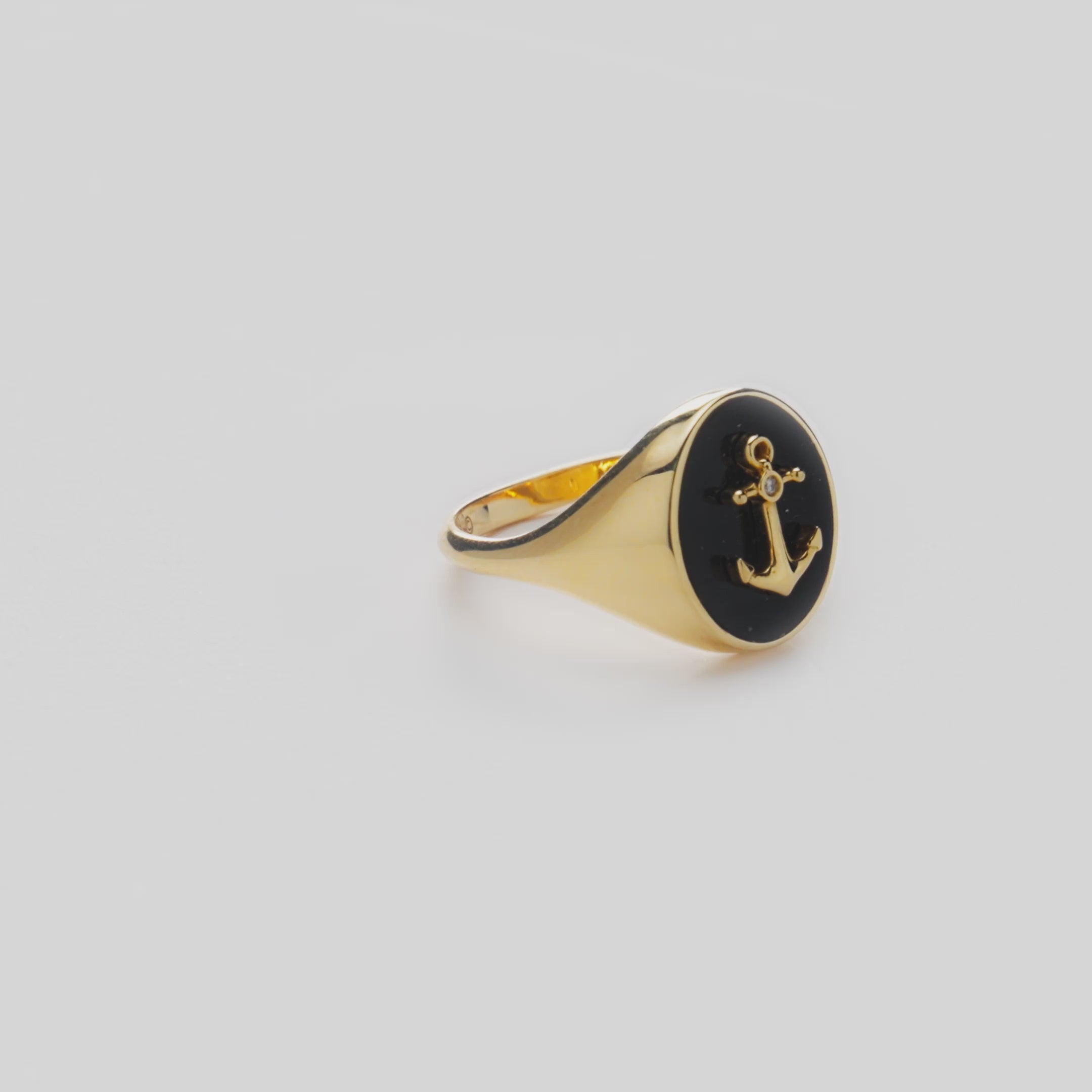 Video of Sealife Anchor Black Coral Signet Ring in Gold with Diamond on white turntable