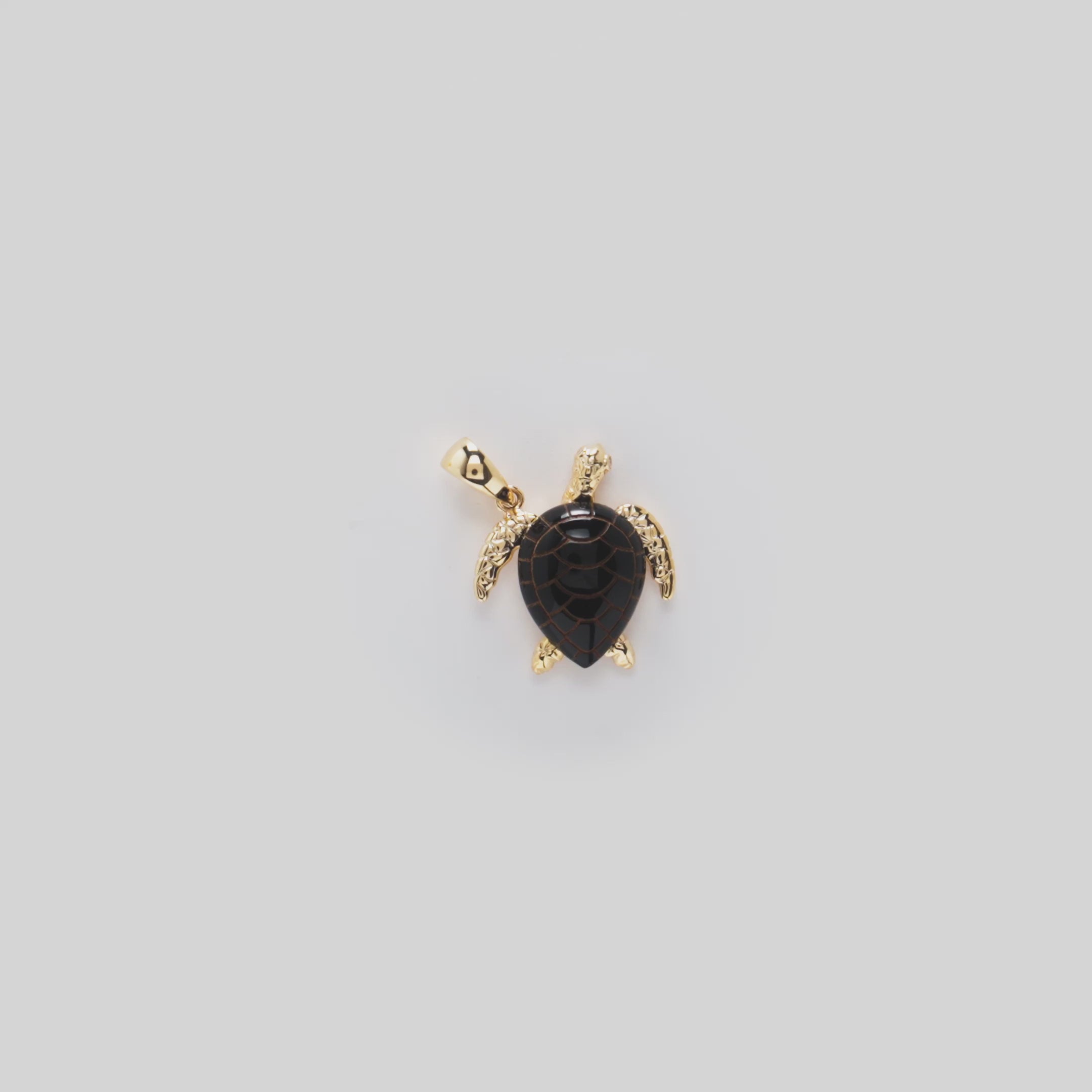 Video showcasing the 19mm Honu Black Coral Pendant in 14k Yellow Gold with Diamonds