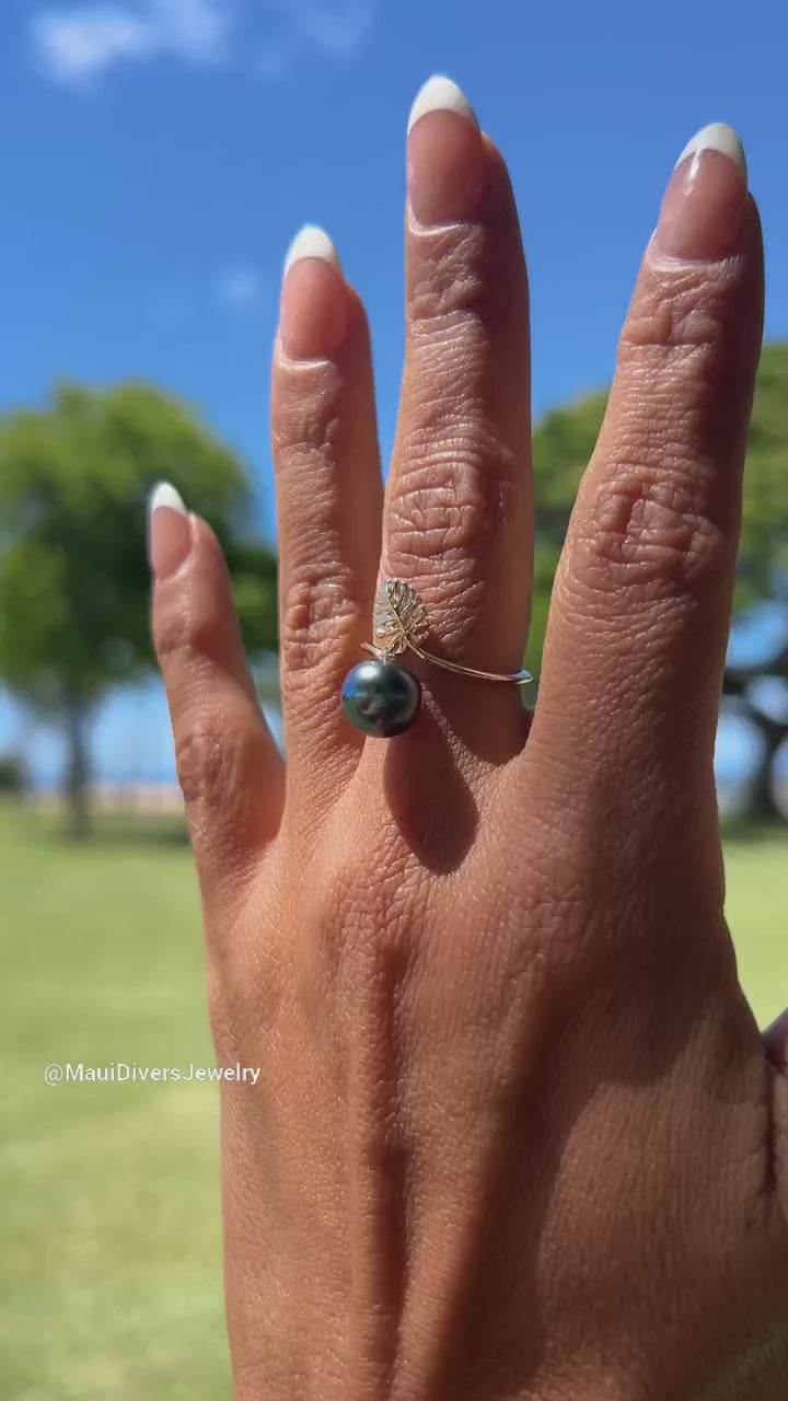 Video of a woman's hand wearing a Monstera Tahitian Black Pearl Ring in Gold - Maui Divers Jewelry