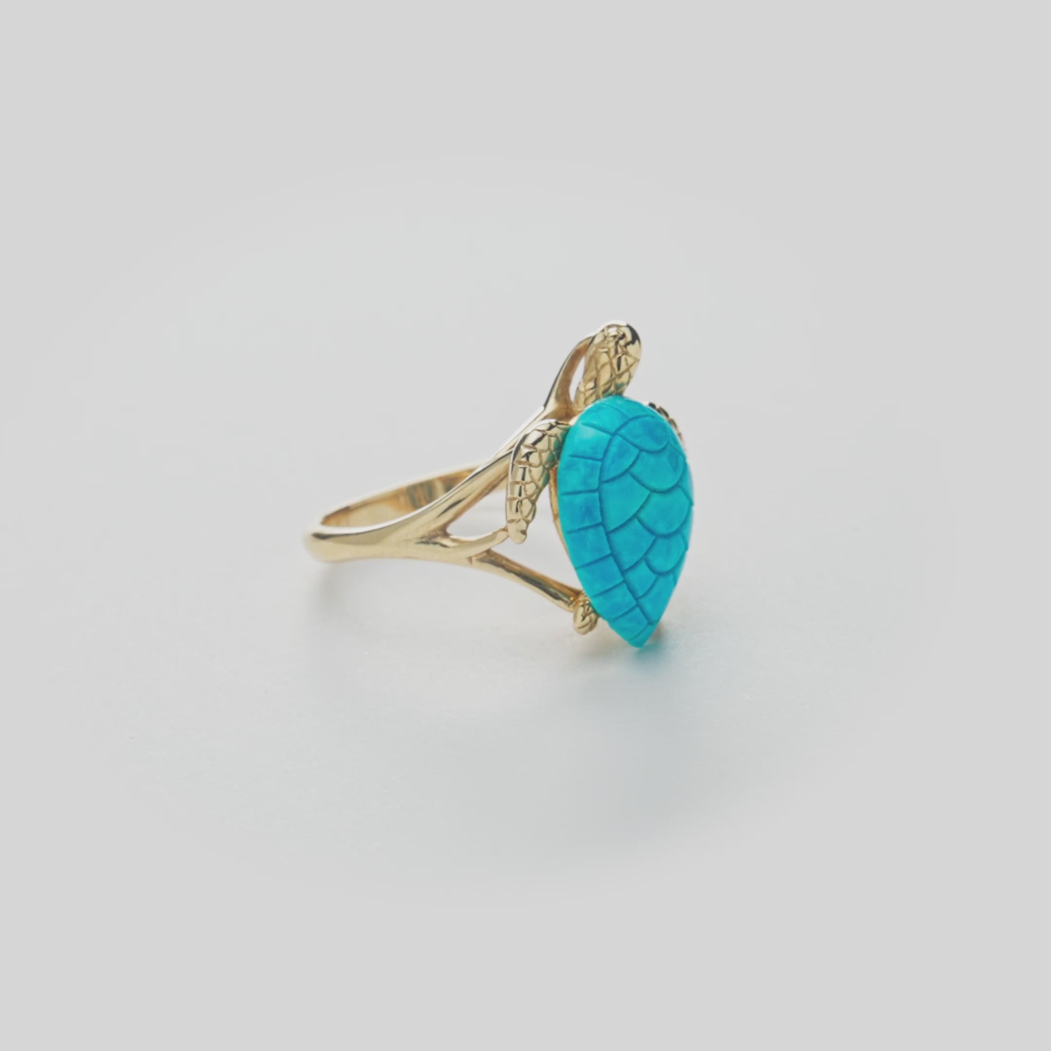 Honu Turquoise Ring in Gold on white turn table