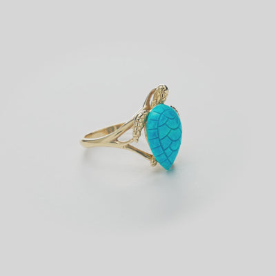 Honu Turquoise Ring in Gold on white turn table