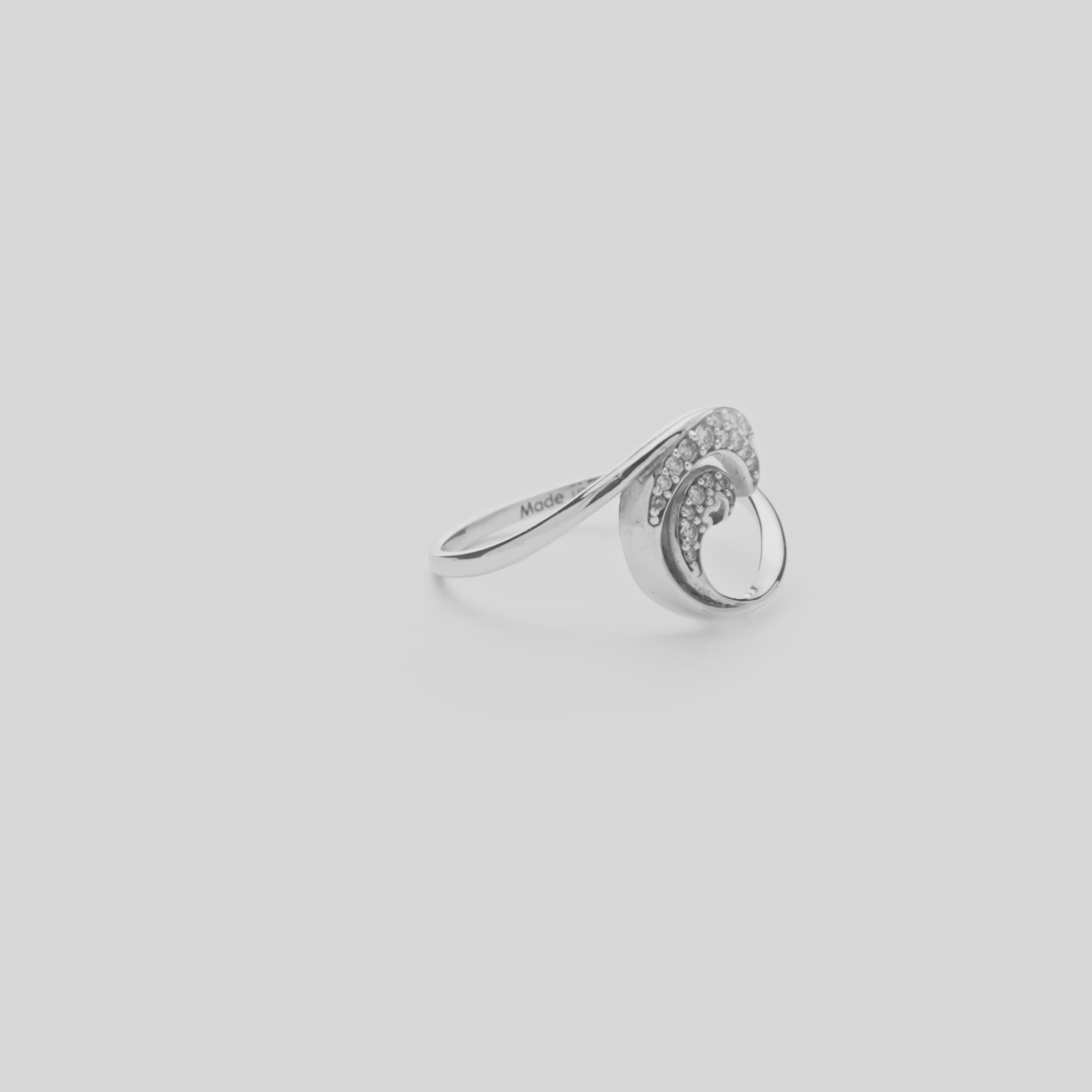 12mm Nalu Ring in White Gold with Diamonds on a white turntable