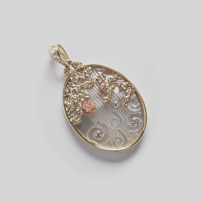 Video of ʻŌhiʻa Lehua Waterfall Mother of Pearl Pendant in Two Tone Gold with Diamonds on a white turntable