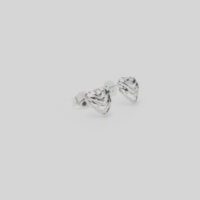 Video of Aloha Heart Earrings in Sterling Silver on a white turntable