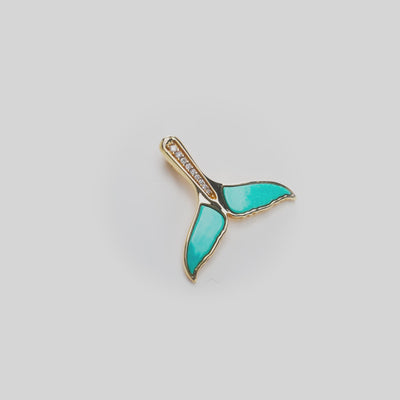 Video of Sealife Whale Tail Turquoise Pendant in Gold with Diamonds on white turntable