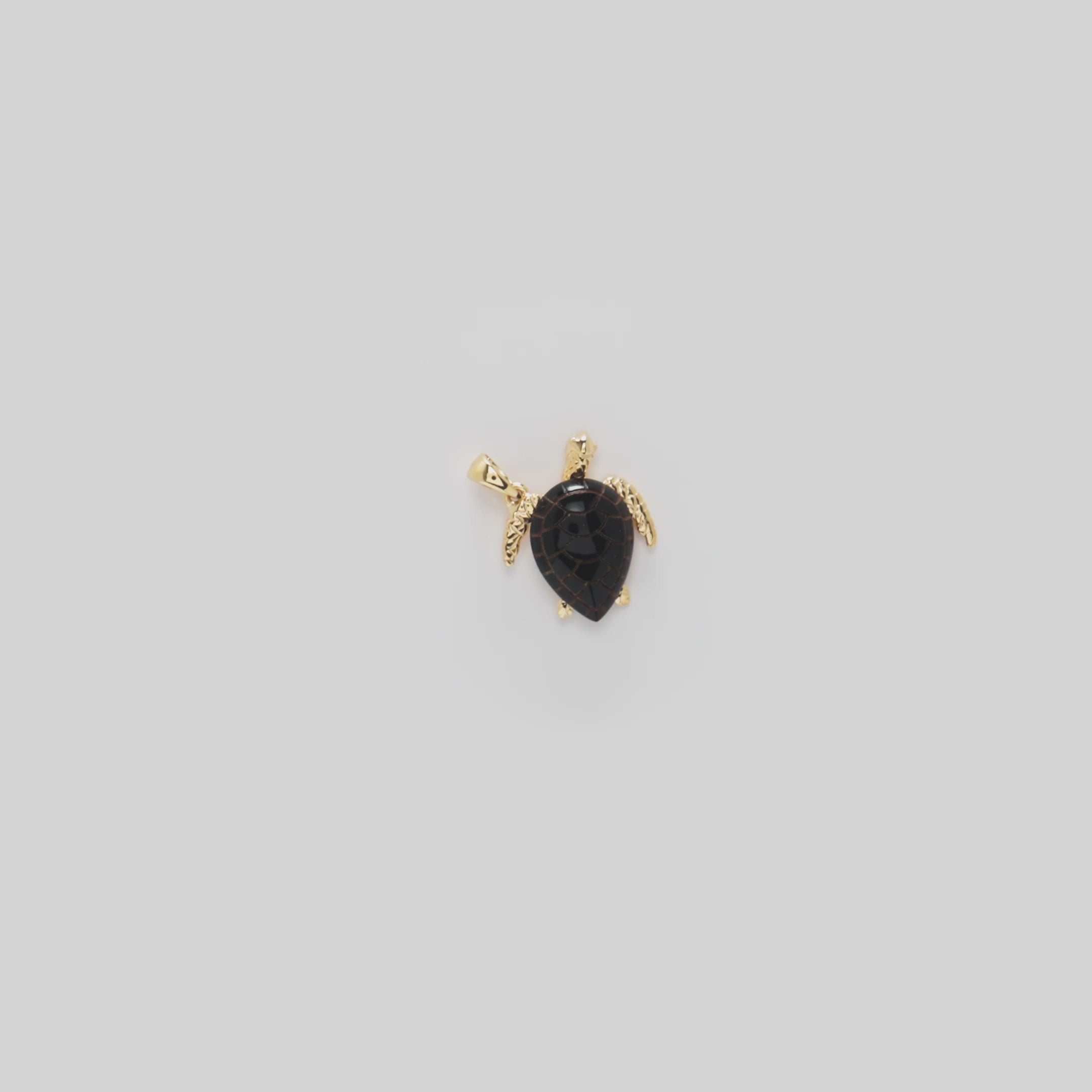 Video showcasing the 15mm Honu Black Coral Pendant in 14k Yellow Gold