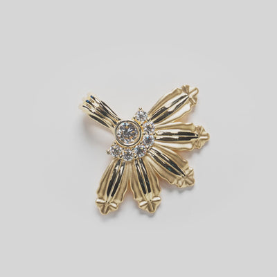 Close up video of the Mountain Naupaka Pendant in Gold with Lab Grown Diamonds  on white turntable