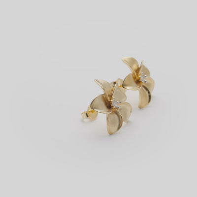 Video showcasing the 18mm Plumeria Diamond Stud Earrings in 14k Yellow Gold