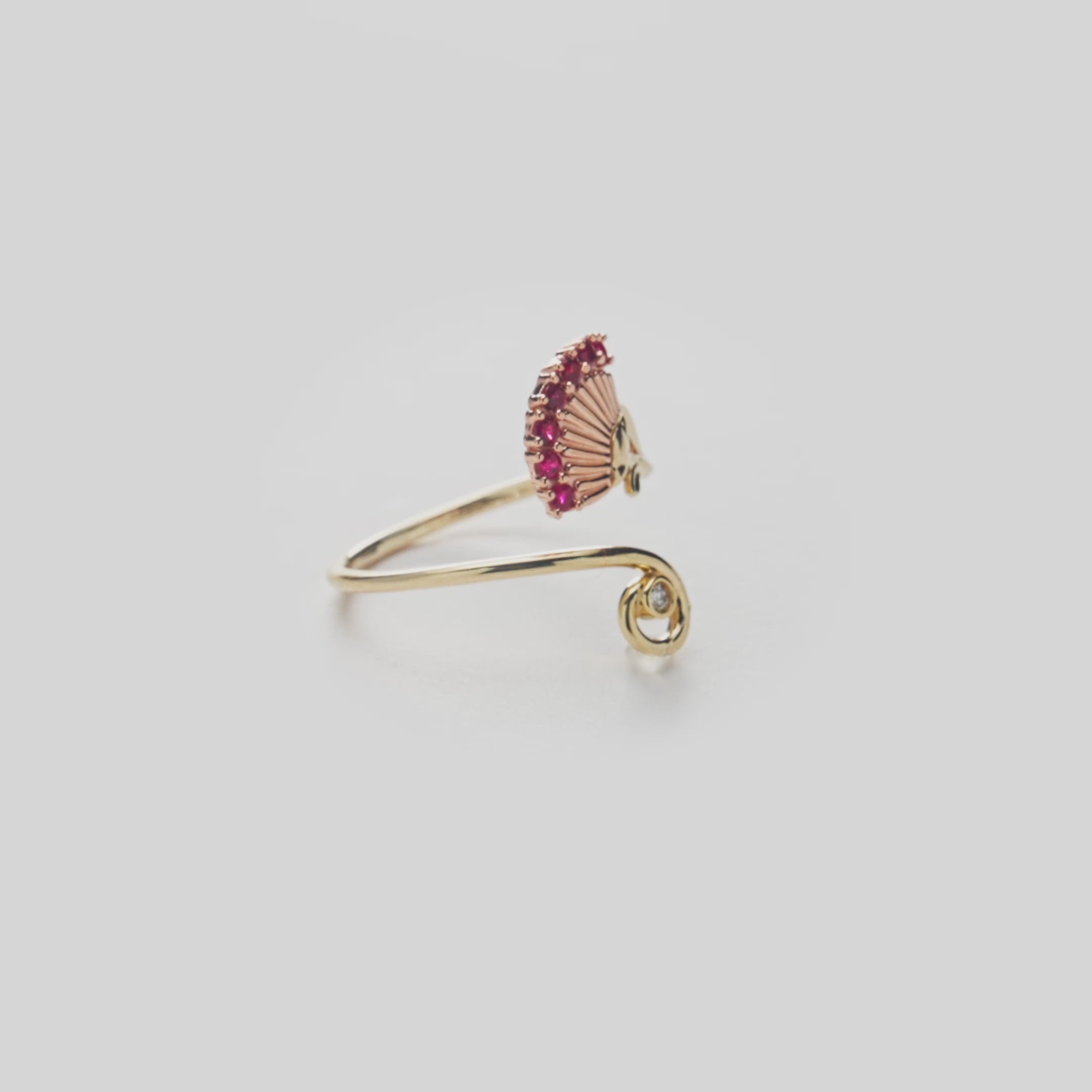 ʻŌhiʻa Lehua Ruby Ring in Two Tone Gold with Diamond on a white turntable