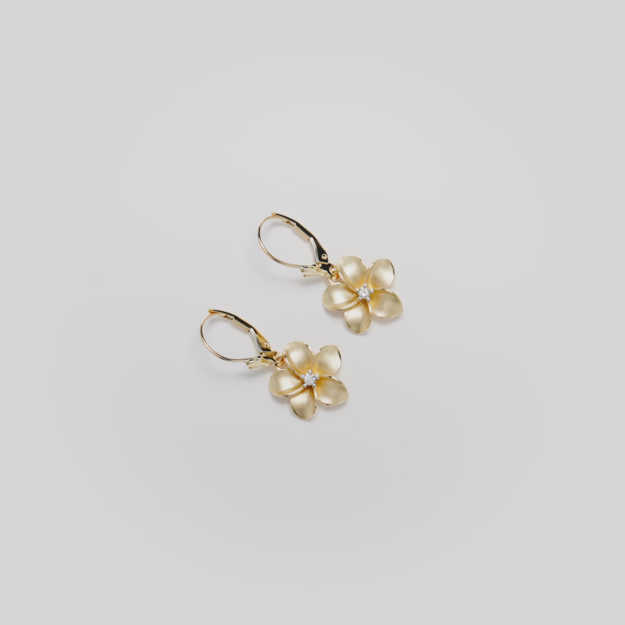 Video showcasing the 13mm Plumeria Diamond Leverback Earrings in 14k Yellow Gold