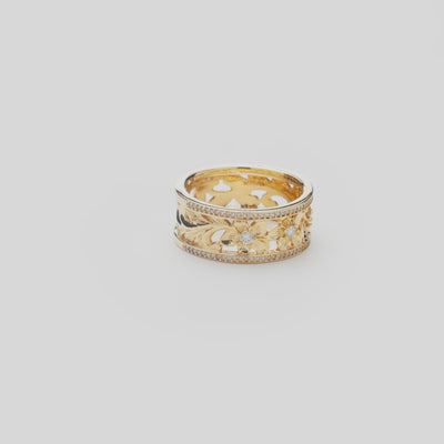 Hawaiian Heirloom Plumeria Ring in Gold with Diamonds on a white turntable