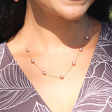 A woman's chest with a Mixed Freshwater Floating Pearl Necklace in Gold - 5-6mm - Maui Divers Jewelry