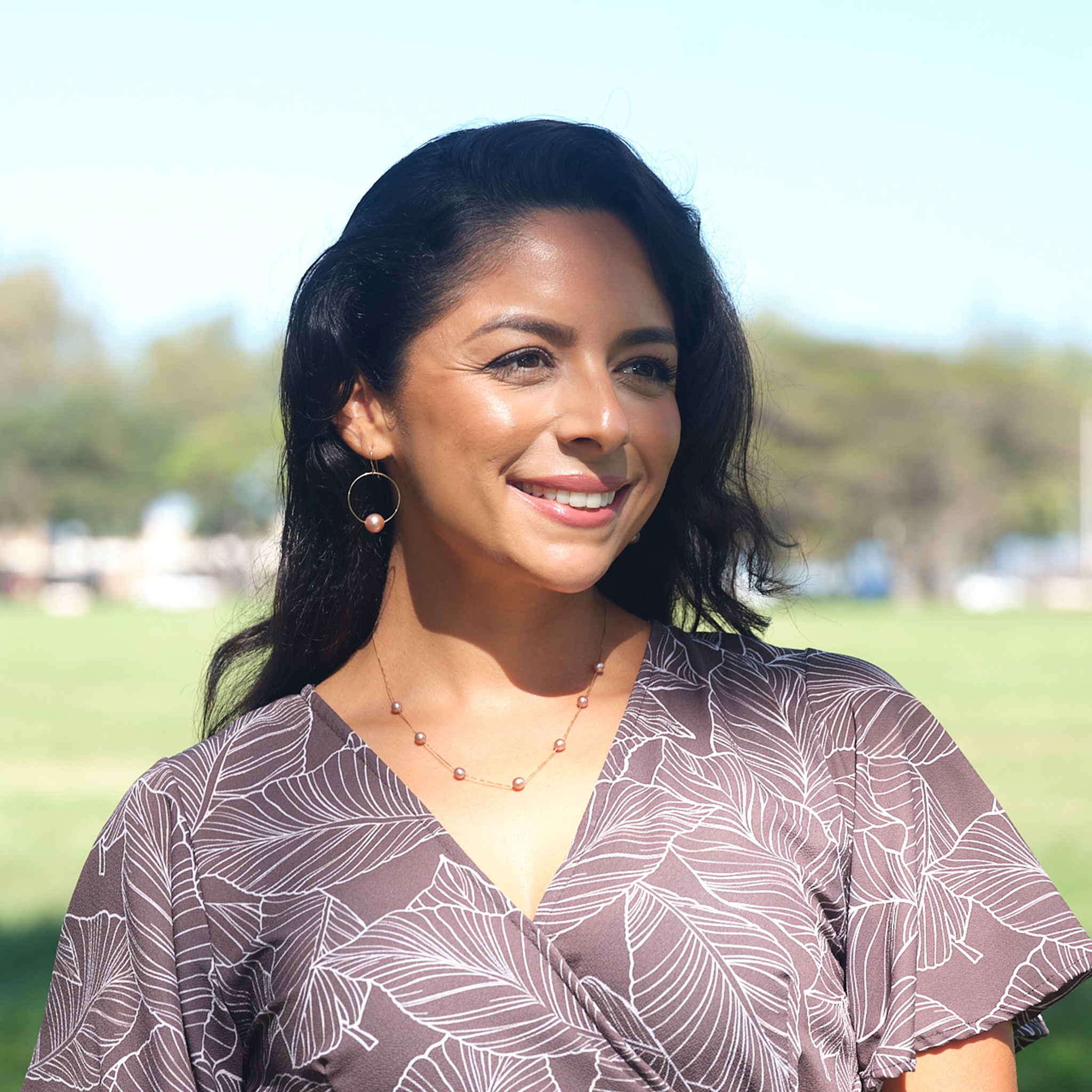 A woman wearing a Mixed Freshwater Floating Pearl Necklace in Gold - 5-6mm - Maui Divers Jewelry