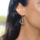 A woman's ear with Moon & Star Mermaid Earrings in Two Tone Gold with Diamonds - Maui Divers Jewelry