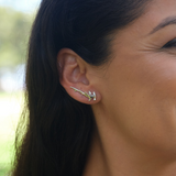 A woman's ear with a Hammerhead Shark Climber Earrings in White Gold - 26mm - Maui Divers Jewelry