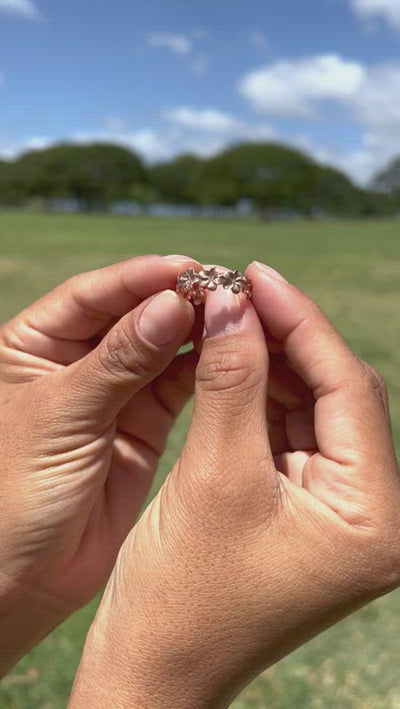 Video of a woman's hand wearing a Plumeria Eternity Ring in Rose Gold with Diamonds - 6mm-Maui Divers Jewelry