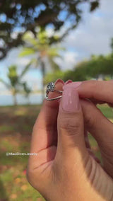 Video of a woman's hand wearing a Nalu Ring in White Gold with Blue Sapphires - 15mm-Maui Divers Jewelry