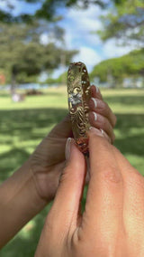 Video of a woman wearing Hawaiian Heirloom Plumeria Bracelet in Tri Color gold with Diamonds - 10mm - Maui Divers Jewelry