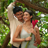 A couple wearing a Monstera Pendant in Gold with Diamonds - 30mm and other jewelry - Maui Divers Jewelry
