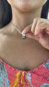 Video of a woman wearing a Plumeria Tahitian Black Pearl Pendant in White Gold with Diamond - 9mm-Maui Divers Jewelry