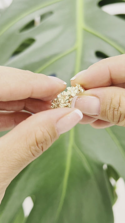 Video of a woman's hand wearing a Plumeria Eternity Ring in Gold with Diamonds- 6mm - Maui Divers Jewelry