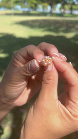 video of a woman's hand wearing a Tiny Bubbles Peach Freshwater Pearl Ring in Gold with Diamonds - Maui Divers Jewelry