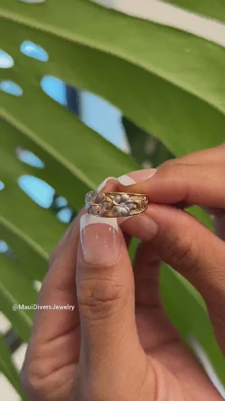 Video of a woman's hand wearing a Hawaiian Heirloom Plumeria Ring in Tri Color Gold with Diamonds - Maui Divers Jewelry