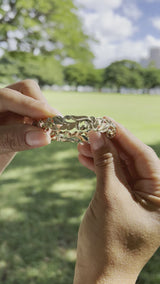 Video of a woman wearing a Hawaiian Heirloom Plumeria Bracelet in Gold-Maui Divers Jewelry