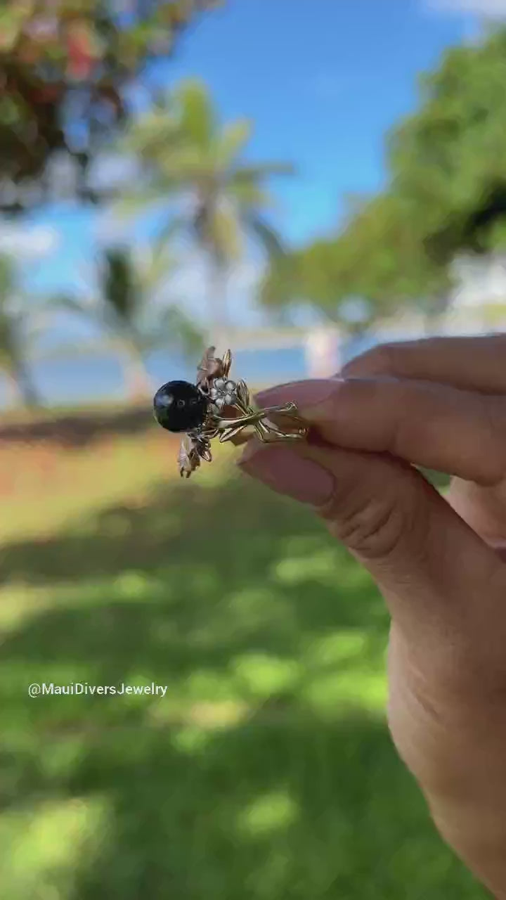 Video of a woman's hand wearing a Pearls in Bloom Tahitian Black Pearl Ring in Tri Color Gold with Diamonds - 22mm-Maui Divers Jewelry